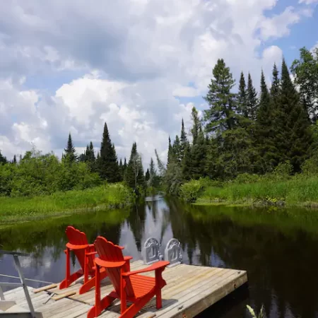 Relax on Muskoka chairs and watch the river flow by.