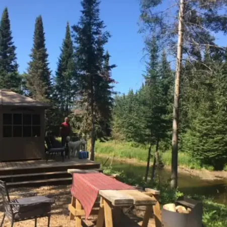 Enclosed gazebo contains a Hot Tub, Sauna, small fridge, Basic cookware and utensils, washing station and BBQ