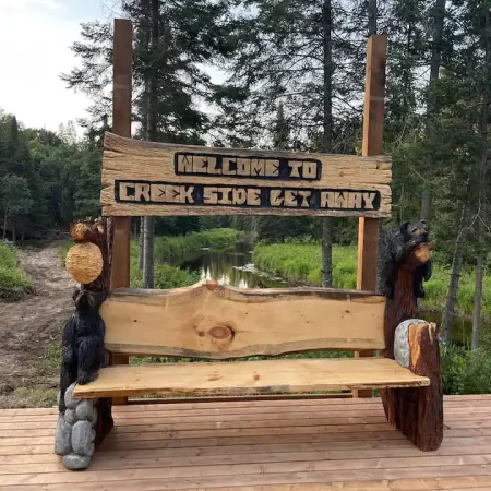 Welcoming bears bench to Muskoka Cottage.