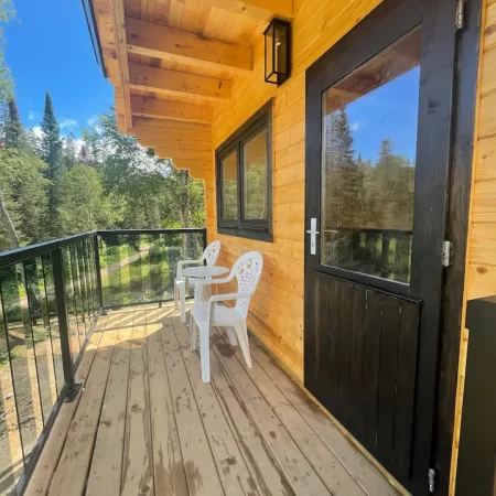 Treehouse accommodations with an outdoor patio.