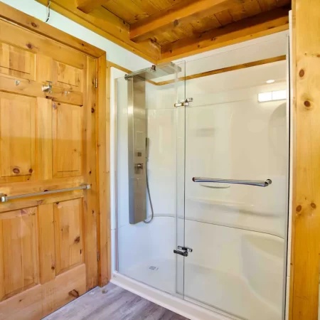 The main bathroom in muskoka cottage has a walk in shower and all the essentials